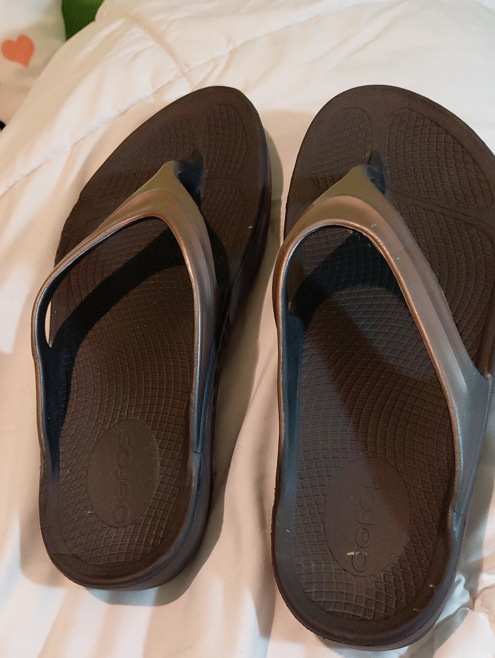 OOFOS Black Footbed with Bronze Metallic Strap Flip Flops